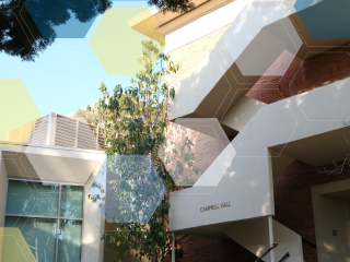 Looking up at UCLA Campbell Hall stairway with white, yellow, and blue molecule overlay.