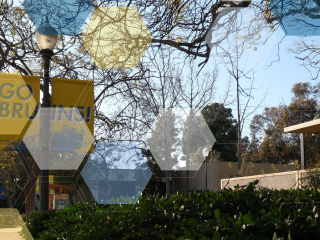 Go Bruins! lamppost sign with a blue, yellow, and white UCLA molecule overlay