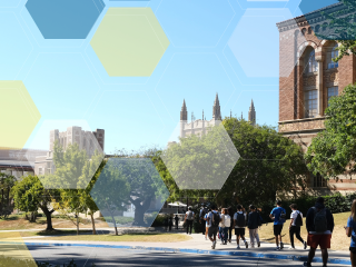 Students walking past gothic brick buildings partially obscured by green trees.